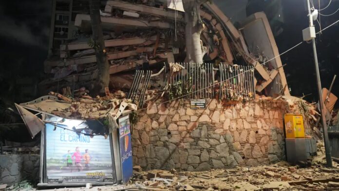A collapsed building after an earthquake in Caracas, Venezuela, Wednesday, June 24, 2026. (AP Photo/Adrian Naranjo)