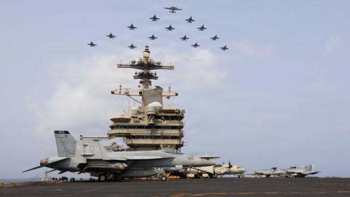 U.S. Navy aircraft and warships transit the Arabian Sea in close formation as CENTCOM forces continue to promote regional security and stability, June 30, 2026. (U.S. Navy photo) Punto della mattinata: Hormuz chiuso, raid iraniani e stretta cinese sull’AI mentre Trump alza i dazi al Canada